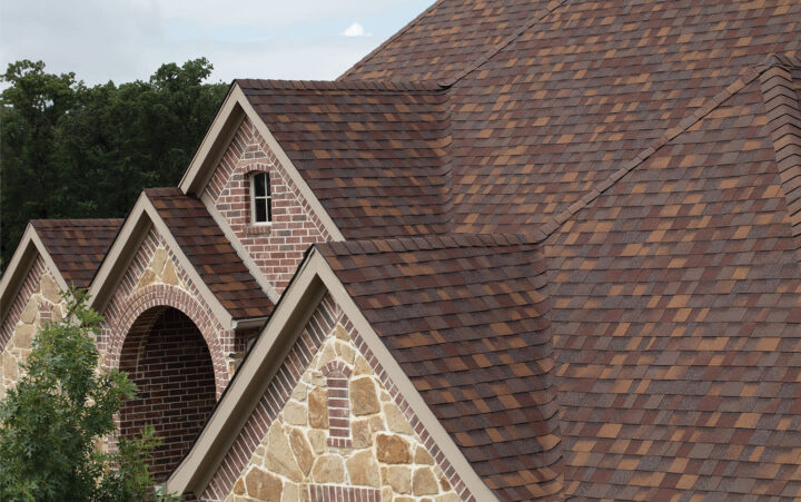 beautiful brown colored shingles on residential roof after roof replacement